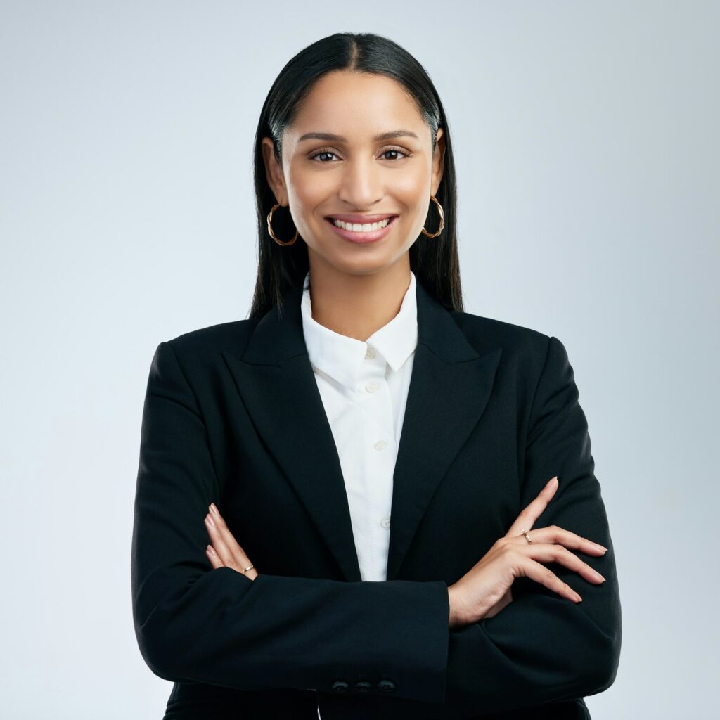 shot-of-a-confident-young-businesswoman-standing-against-a-grey-background.jpg